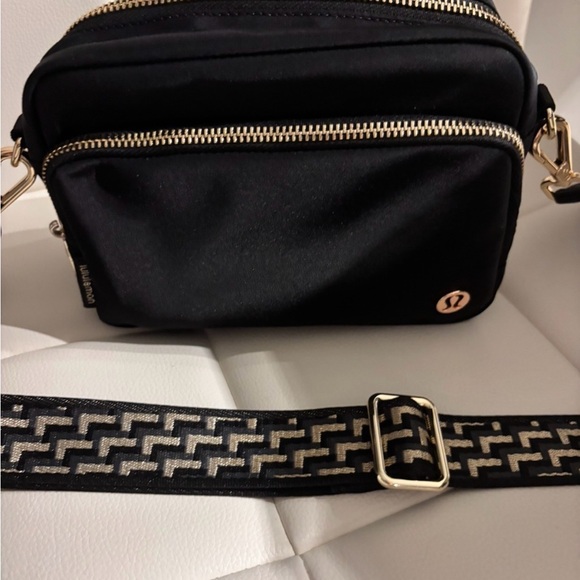 lululemon athletica Handbags - Lululemon Athletica Black Crossbody Bag with Gold Accents